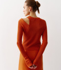 A jumper suit, a combination of two tops and a mini skirt of an asymmetric cut terracotta