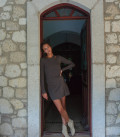 A jumper suit, a combination of two tops and a mini skirt of an asymmetric cut capuccino
